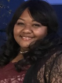 Head shot of Quendra Brown smiling long black hair